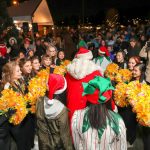 Santa received a festive welcome from the Inglemoor High School cheerleaders. Heston Photography