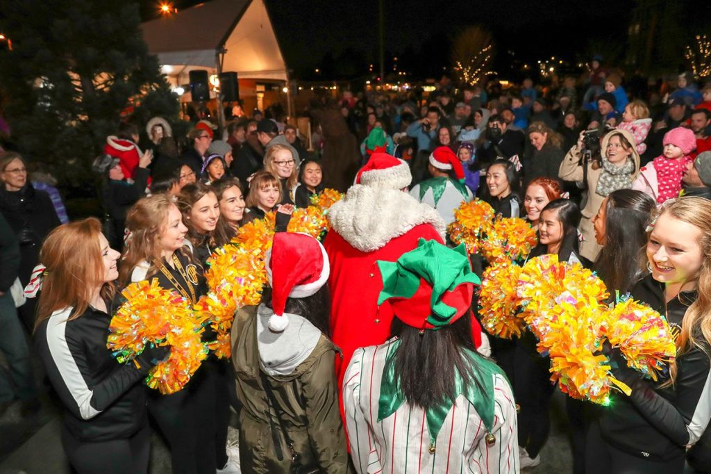 Santa received a festive welcome from the Inglemoor High School cheerleaders. Heston Photography