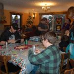 Patrons at Zulu&rsquo;s Board Game Cafe in Bothell create holiday ornaments made from old board game pieces. Contributed photo