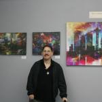 Artist David Baker poses with some of his pieces on display in the Museum of Special Art&rsquo;s &ldquo;Colors of My World&rdquo; exhibit. CATHERINE KRUMMEY/Bothell Reporter
