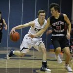 Cedar Park senior Drew McLaurin goes behind his back to get around a Seattle Christian defender. McLaurin led the Eagles with 14 points. JOHN WILLIAM HOWARD/Bothell-Kenmore Reporter