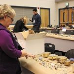 Gail Genereau of Lake Forest Park scours the items recovered from the &ldquo;Movie Bandits&rdquo; burglaries in 2012 at the Redmond Police Department as the result of a Pro-Act investigation. She found some of her stolen jewelry. File Photo