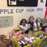 During November students and parents of Evergreen Academy Preschool in Bothell donated items for a food drive to celebrate the Apple Cup. Contributed photo