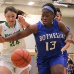Bothell senior Keyonna Jones fights for a loose ball during the first half of the Cougars&rsquo; win over Woodinville on Jan. 6. JOHN WILLIAM HOWARD/Bothell-Kenmore Reporter