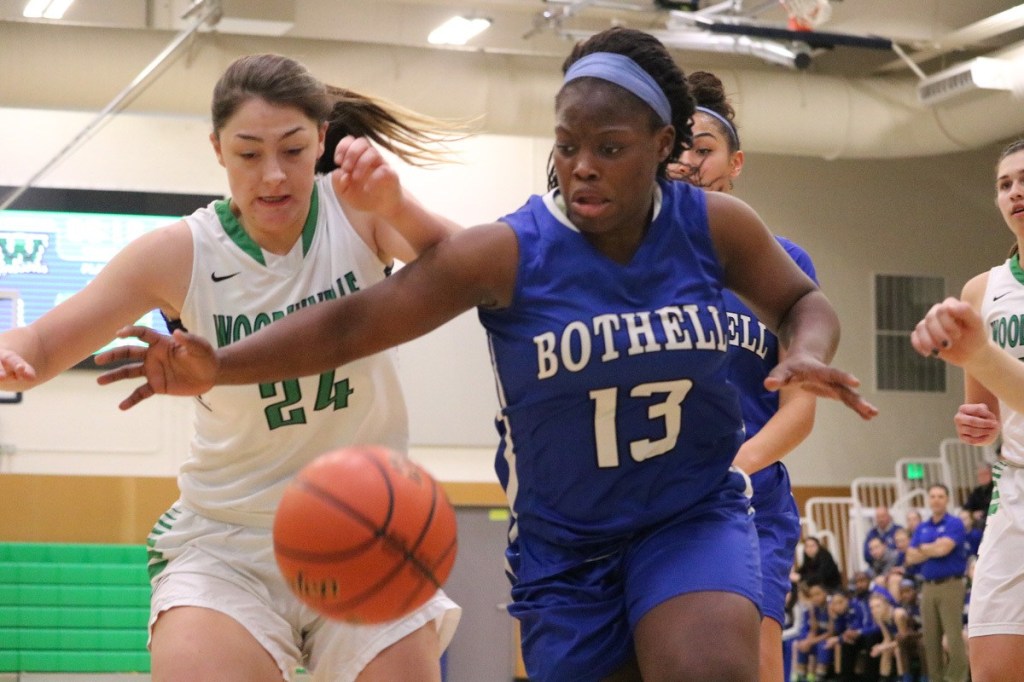 Bothell senior Keyonna Jones fights for a loose ball during the first half of the Cougars&rsquo; win over Woodinville on Jan. 6. JOHN WILLIAM HOWARD/Bothell-Kenmore Reporter