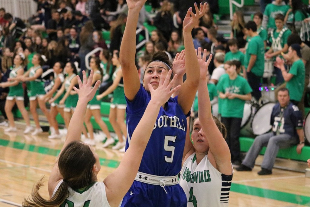 Bothell post Taya Corosdale (5) often had to fight through double teams, but finished with a game-high 17 points for the Cougars on Jan. 6. JOHN WILLIAM HOWARD/Bothell-Kenmore Reporter