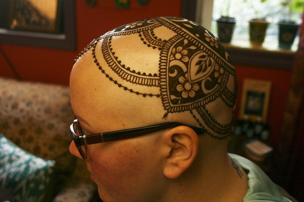 Mary Glasco shows off her henna crown, created by Kirkland artist Sarah Walters at Sankara Imports in Bothell. CATHERINE KRUMMEY / Kirkland Reporter