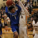 Bothell junior Da&rsquo;Vicious Wilson (1) challenges Inglemoor&rsquo;s Jack Weyer (20) at the rim during Friday&rsquo;s game at Inglemoor High School. JOHN WILLIAM HOWARD/Bothell-Kenmore Reporter
