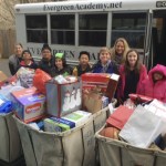 Evergreen Academy students pose with some of the items donated to Childhaven. Contributed photo