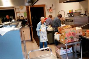 Volunteers prepare a meal for the St. Brendan Catholic Church&rsquo;s SOS program. Contributed photo