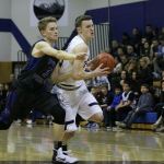 South Whidbey sophomore Kody Newman (5) tangles with Cedar Park Christian&rsquo;s Drew McLaurin during a fast-break attempt in the second half of Friday&rsquo;s Cascade Conference game at Cedar Park Christian School in Bothell. JOHN WILLIAM HOWARD/Bothell-Kenmore Reporter