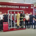Ram Air Gear Dryer Director of Sales David Adams (left) presents a dryer, won in his company&rsquo;s Hometown Heroes contest, to Northshore Fire Department staff in Kenmore. CATHERINE KRUMMEY/Kenmore Reporter