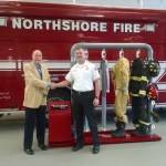 Ram Air Gear Dryer Director of Sales David Adams (left) presents a dryer, won in his company&rsquo;s Hometown Heroes contest, to Northshore Fire Department Deputy Chief Eric Magnuson, who entered the contest on the department&rsquo;s behalf. CATHERINE KRUMMEY / Kenmore Reporter