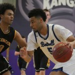 Bothell&rsquo;s Cameron Tyson drives against Inglemoor senior Jalen Woodley in the first half of Saturday&rsquo;s KingCo tournament semifinal at Lake Washington High School. Bothell won, 44-39, behind 16 points from Tyson. JOHN WILLIAM HOWARD/Bothell-Kenmore Reporter