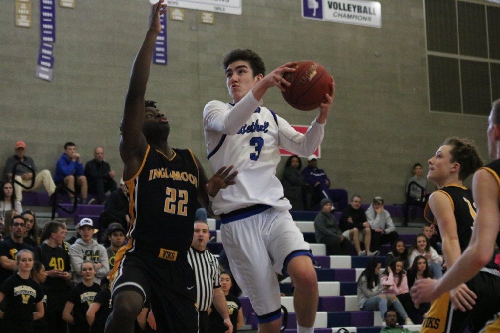 Bothell&rsquo;s Josh Kollman shoots over Inglemoor senior Chinedu Ugokwoli. Kollman finished with seven points for the Cougars. JOHN WILLIAM HOWARD/Bothell-Kenmore Reporter