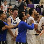The Bothell High boys basketball team celebrates after beating Skyline, 54-42, in the 4A KingCo tournament championship game on Thursday at Lake Washington High School in Kirkland. JOHN WILLIAM HOWARD/Bothell-Kenmore Reporter