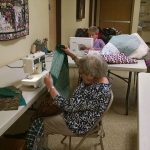 Betty Magee and Helga Smith work on quilts at First Lutheran Church of Bothell on Feb. 2. CATHERINE KRUMMEY / Bothell Reporter