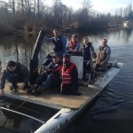 Volunteers move across Swamp Creek in a Hobie Cat with supplies during a previous replanting event. Contributed photo