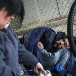 Gretchen Holtz, a volunteer from Compass Health, gathers information from Steve near the Everett Gospel Mission during the annual Point in Time Homeless Count on Tuesday, Jan. 24, 2017 in Everett. Volunteers conducted interviews and passed out resources in areas throughout Snohomish County. (Daniella Beccaria / The Herald)