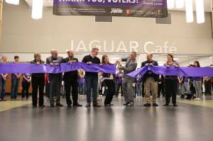 North Creek High School principal Eric McDowell, center, cuts the ribbon to signal the official opening of NCHS in November 2016. The school will host an education funding forum on March 11. Reporter file photo