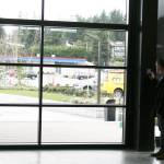 Kenmore City Manager Rob Karlinsey operates the control panel to open one of the walls in the Hangar Building up to the Town Square. CATHERINE KRUMMEY/Kenmore Reporter