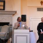 Bothell City Councilmember James McNeal and Bothell Police Captain Mike Johnson give a presentation on the &ldquo;Cops and Cards&rdquo; program at a Sound Cities Association dinner in Kenmore. CATHERINE KRUMMEY / Kenmore Reporter