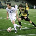 Bothell midfielder Arlo Dolven (8) maneuvers past Inglemoor&rsquo;s Orion Atlee (10) during Bothell&rsquo;s KingCo 4A boys soccer matchup against Inglemoor Friday night at Pop Keeney Stadium. The Cougars beat the Vikings 2-0 (Joe Livarchik/staff photo).