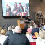 Northshore Schools Foundation Board President Teri Foose speaks with scholarship recipients Kelsey Heintz (Bothell High School), Edward Yang (Inglemoor High School) and Madison Wittman (Woodinville High School). CATHERINE KRUMMEY / Bothell Reporter