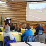 Community-building expert Peter Kageyama talks about the St. Vincent de Paul building mural during a &ldquo;For the Love of Kenmore&rdquo; event at Kenmore City Hall. CATHERINE KRUMMEY / Kenmore Reporter