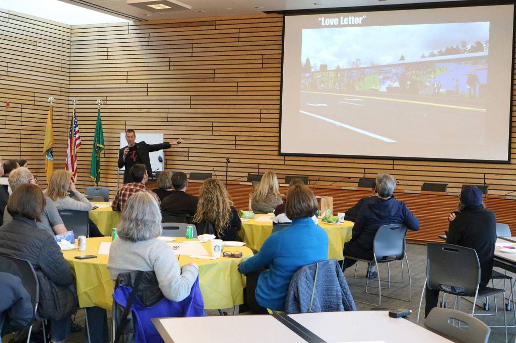 Community-building expert Peter Kageyama talks about the St. Vincent de Paul building mural during a &ldquo;For the Love of Kenmore&rdquo; event at Kenmore City Hall. CATHERINE KRUMMEY / Kenmore Reporter