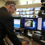 Gov. Jay Inslee clicks a button to open the Interstate 405 northbound peak-use shoulder lane to traffic for the first time. CATHERINE KRUMMEY / Bothell Reporter