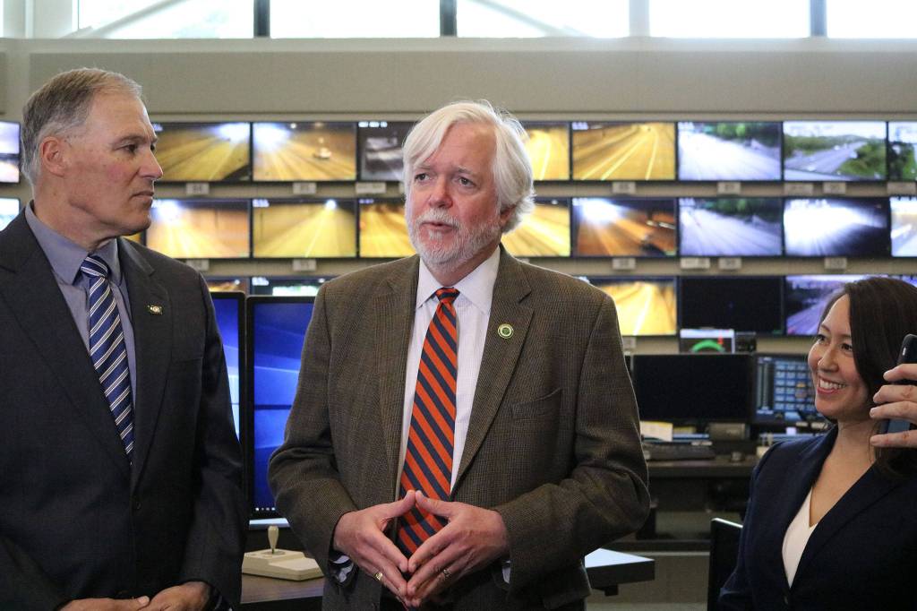 Gov. Jay Inslee, Secretary of Transportation Roger Millar and Bothell Deputy Mayor Davina Duerr answer questions after opening the Interstate 405 northbound peak-use shoulder lane in Bothell to traffic for the first time. CATHERINE KRUMMEY / Bothell Reporter