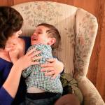 Deanna Fisher tickles her youngest autistic son, Colin, 4, at their home in Bothell. The Fishers are volunteering baby teeth for a study to determine if prenatal exposure to chemicals increases a child&rsquo;s chances of developing the autism. (Kevin Clark / The Herald)
