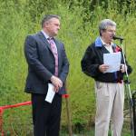 Bothell Mayor Andy Rheaume listens as Help Our Woods&rsquo; Paul Clement addresses the crowd. CATHERINE KRUMMEY / Bothell Reporter