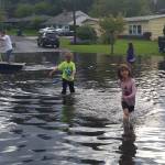 Local residents check out the water buildup near the intersection of 145th Street and 75th Avenue at the Kirkland-Kenmore boundary. Contributed photo