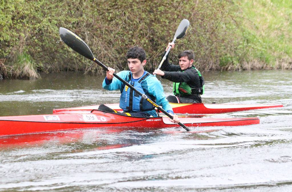Patrick Armitano, 14, leads brother Kevin Armitano, 15, during their afternoon kayak practice on April 17 on the Sammamish River. Joe Livarchik/staff photo