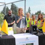 Bothell Mayor Andy Rheaume and Northshore School District Board President Amy Cast celebrate the installation of pedestrian flags at a variety of intersections near NSD schools alongside Frank Love Elementary School students. CATHERINE KRUMMEY / Bothell Reporter