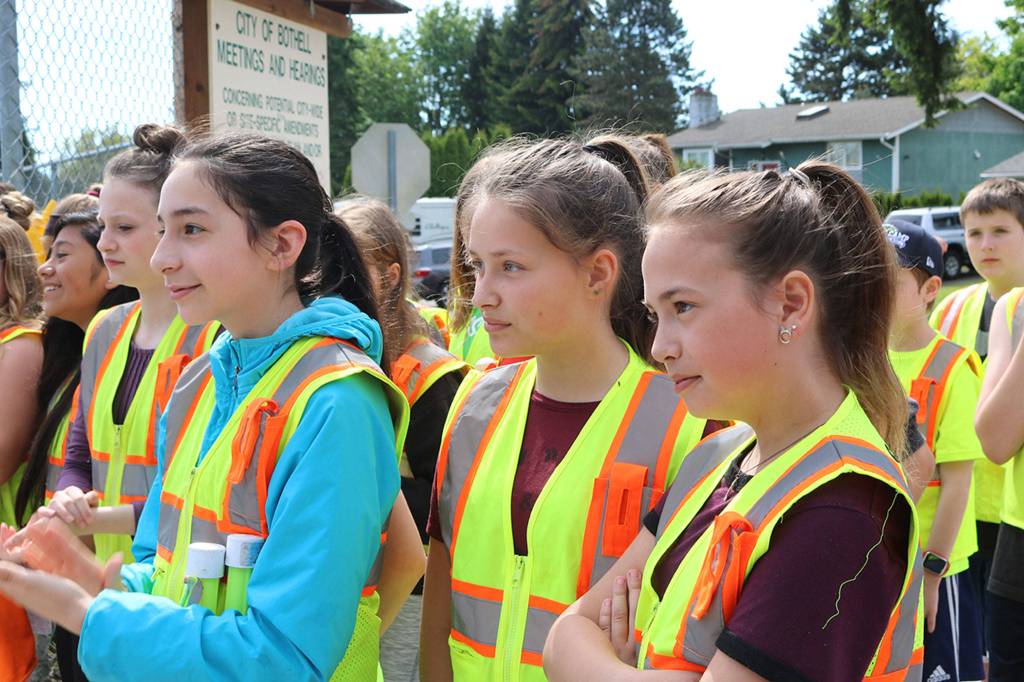 Frank Love Elementary School students listen to remarks from local leaders celebrating the installation of pedestrian flags near 12 schools. CATHERINE KRUMMEY / Bothell Reporter