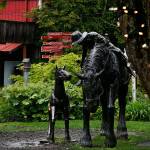 A whimsical sculpture of a western scene centers one of several cozy courtyards found between the shop buildings in Bothell&rsquo;s Country Village, Thursday. (Dan Bates / The Herald)