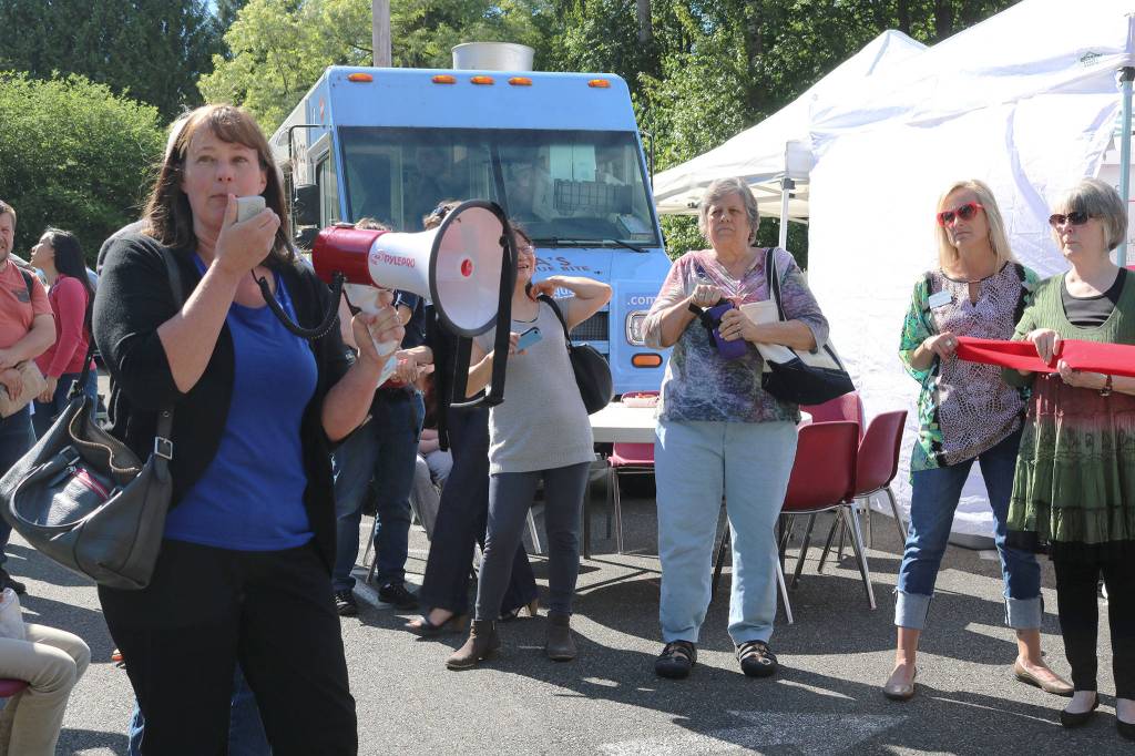 Kenmore City Councilmember Stacey Denuski addresses the crowd at the Kenmore Community Market opening. CATHERINE KRUMMEY / Bothell-Kenmore Reporter