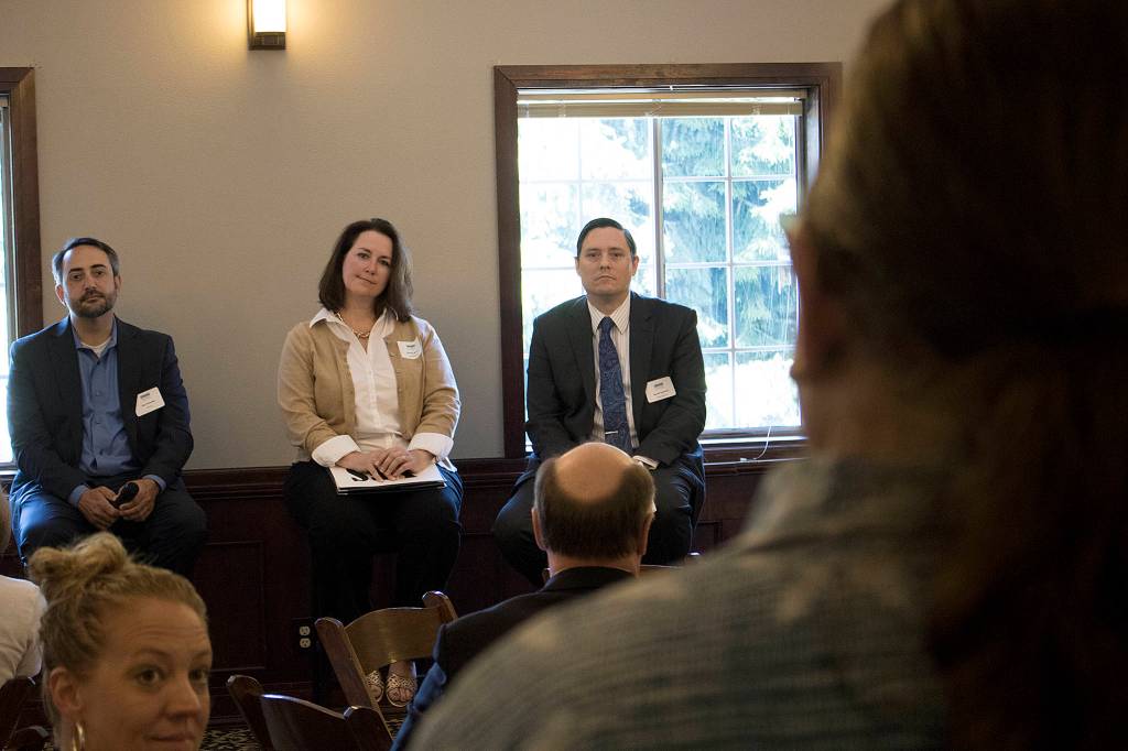 Steve Holmes, owner of WhatsSup Stand-Up Paddle and Surf, stands up to ask Sen. Guy Palumbo (Left), Rep. Shelley Kloba (Center) and Rep. Derek Stanford (Right) about highway tolls during a Greater Bothell Chamber of Commerce luncheon last week.