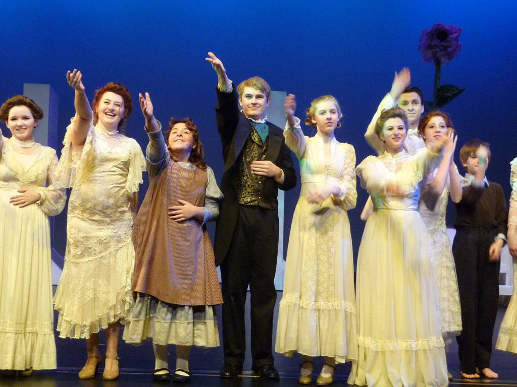 Ryan Armstrong (center) during a performance from his earlier days in theater. Courtesy of Ryan Armstrong