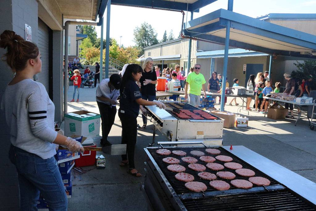 In the courtyard, families filled themselves on hamburgers, veggieburgers and hot dogs. Megan Campbell, Bothell/Kenmore Reporter
