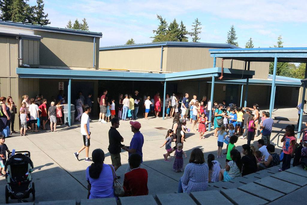 In the courtyard, families filled themselves on hamburgers, veggieburgers and hot dogs. Megan Campbell, Bothell/Kenmore Reporter