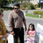 Community Relations Manager Leslie Harris speaks to Jesus Dios and his four-year-old daughter, Alyssa, during the ribbon cutting Aug. 23. Megan Campbell, Bothell/Kenmore Reporter