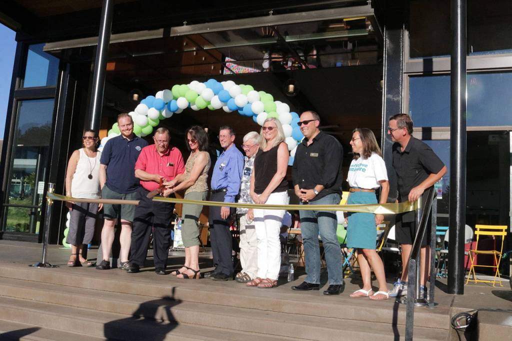 Current and former Kenmore City Council members cut the ribbon opening Town Square and the Hangar building Saturday. Megan Campbell, Bothell/Kenmore Reporter