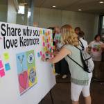 Amy Cast, of the Northshore School Board, puts a sticky note about why she loves Kenmore during the celebration Saturday. &ldquo;The people (in Kenmore) are beyond compare,&rdquo; she said. Megan Campbell, Bothell-Kenmore Reporter