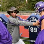 Kevin Clark / The Herald Torrey Myers, the head football coach at North Creek High School, instructs players during practice Friday at the school.