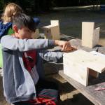 Ayateway Newman builds a bird house during Outdoor Education Day on Sept. 22. Courtesy of PACE at Woodmoor