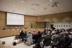 (Left to Right) Bothell City Council candidates Aaron Moreau-Cook, Thomas Agnew, Vicki Somppi, Rosemary McAuliffe, Liam Olsen and Jeanne Zornes answer community questions in the nearly full council chambers. Kailan Manandic, Bothell-Kenmore Reporter